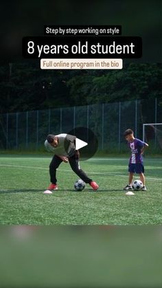 two young boys are playing soccer on the field with an advertizer in the background