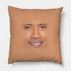 a brown pillow with a smiling man's face on it