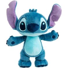 a stuffed animal that is blue and has ears on it's head, with one hand in the air