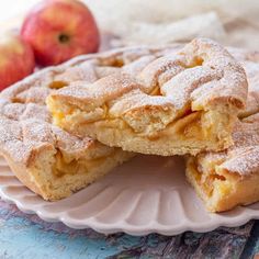 two pieces of apple pie on a plate