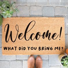 a welcome mat that says, welcome what did you bring me?