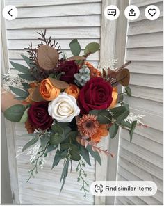 a bouquet of flowers sitting on top of a wooden door