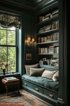 a living room filled with lots of books on top of a book shelf next to a window