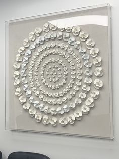 a white wall with a circular design on it