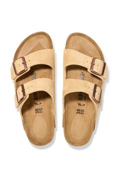 The classics never go out of style and these Birkenstock Arizona Suede Sandals in Latte Cream are ones you will never get tired of. Arch support, custom fit, and wide double straps with adjustable metal buckles are features that make up this fashion staple footwear. Features: Birkenstock Style: 1026190 Color: Latte Cream Women's sandals Cork footbed EVA outsole Two straps with adjustable metal buckles Arch support Deep heel cup Footbed conforms to the shape of your foot Birkenstock branded logo Cream Birkenstock, Fuzzy Heels, Womens Casual Boots, Cream Sandals, Birkenstock Sandals Arizona, Over The Calf Socks, Mens Boots Casual, Waterproof Winter Boots, Pull On Boots