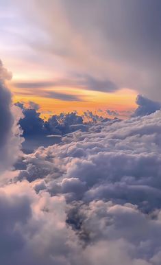 the sky is filled with clouds as the sun sets over the horizon in this photo