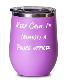 a purple tumbler with the words keep calm i'm almost a police officer