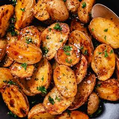 cooked potatoes with parsley in a pan