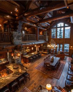 a living room filled with lots of furniture and a fire place in the middle of it