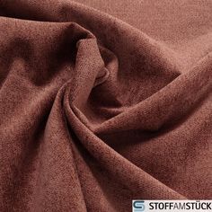 a close up view of a brown fabric with a small amount of wrinkles on it