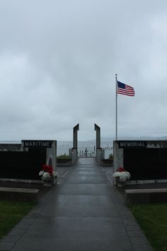 an american flag is flying over the memorial