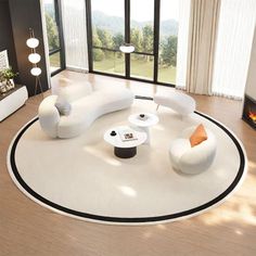 a modern living room with white furniture and large windows overlooking the valley in the distance