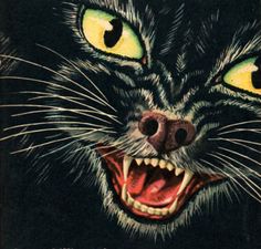 a black cat with yellow eyes and fangs