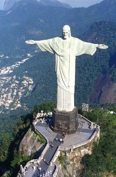 the statue of christ is on top of a mountain