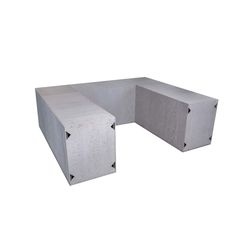 a concrete bench sitting on top of a white floor