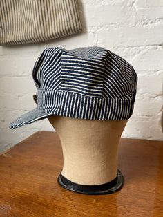 Vintage, made in USA hickory stripe engineer hat that I sewed a vintage wool patch from 1949 to and a 1930s railroad workwear button. One of a kind! Best for a size 7 1/4 or smaller. Adjustable snapback. Gender neutral. All sales are final, so please refer to photos and description. Vintage Adjustable Canvas Hat, Retro Distressed Adjustable Hats, Distressed Cotton Retro Hat, Vintage 5-panel Travel Hat, Vintage Multicolor Adjustable Hat, Engineer Hat, Western Farmhouse, Fall Workwear, Denim Hat