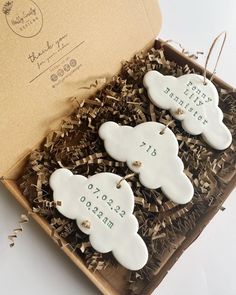 two personalized cookies in a gift box for a baby's first birthday party