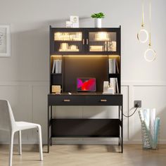 a white chair sitting next to a desk with a computer on top of it in front of a book shelf