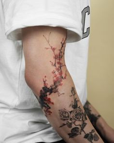 a person with a flower tattoo on their arm