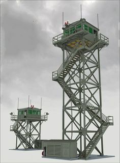 an image of a tower that is in the air with two people on top of it