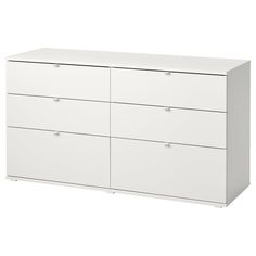 a white dresser with four drawers and two doors