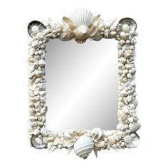 a mirror with shells and seashells on it