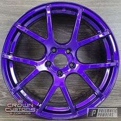 an image of a purple wheel on a wooden surface with the words crown customs and coatings