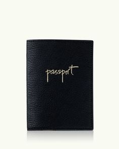 a black leather passport case with the word hope written in gold foil on it, against a white background