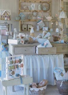 a room filled with lots of different items on top of a wooden dresser next to a table