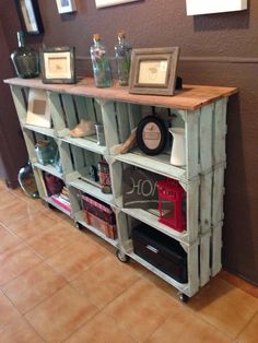 a shelf made out of pallets with pictures on it