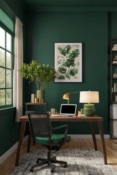 an office with green walls and a desk in front of a large window that has a laptop on it