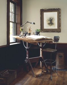 an old fashioned desk in the corner of a room