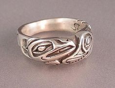 Sterling Silver Wolf & Raven Ring made by Walker Goldsmiths as a tribute to the Haida people. Wolf is a division of the Raven Clan and some people like to wear this ring to show their clan affinity. Some just love Ravens and Wolves because they are the epitome of the wild spirit and so much alike in Raven Ring, Raven And Wolf, Wolf Ring, Eagle Ring, Carved Ring, Silver Wolf, Wild Spirit, Silver Eagles, The Raven