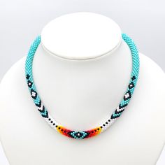 This ethnic turquoise necklace would make a great gift for a woman.This necklace is made of highest quality Japanese Toho beads. Diameter 0.3 inch. (0.7 cm). Necklace is 100% handmade.Add this bold necklace to a maxi dress or simple jeans and a tshirt for a unique look that will get you noticed.Piece of my soul, which I left in this work, will warm you even in the most difficult and sad days. I am sure; this necklace will become your lucky charm that you would enjoy wearing day and night. Handmade Turquoise Beaded Necklaces With Round Beads, Traditional Turquoise Jewelry With Tiny Beads, Handmade Turquoise Beaded Choker Necklace, Traditional Turquoise Choker Necklace, Traditional Turquoise Necklace With Round Beads, Traditional Turquoise Beaded Necklaces With Spacer Beads, Traditional Turquoise Beaded Necklace With Spacer Beads, Turquoise Choker Necklace With Colorful Beads, Loom Beaded Necklace