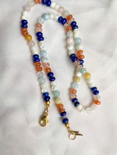 This beautiful rainbow gemstone necklace makes a perfect gift! Each bead is hand knotted onto silk thread, which gives the necklace a lovely drape. Necklace is 19 inches long, hand knotted with white silk string and has gold filled findings. This is a stunning necklace that completes any outfit. This necklace is a perfect gift!   GEMSTONES INCLUDED: Lapis Lazuli Mother of Pearl Shell Sunstone Morganite BENEFITS OF A HAND KNOTTED NECKLACE 1. A knotted necklace is safe and secure. If it should get Gemstone Necklace Diy, Hand Knotted Pearls, Birthday Gift For Girlfriend, How To Clean Earrings, Hand Knotted Necklace, Hemp Jewelry, Birthday Gifts For Girlfriend, Semi Precious Stone, Gift For Girlfriend