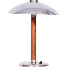 a wooden and metal table lamp on a white background