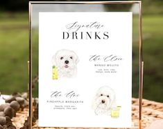 there is a sign on the table that says dogs drink and dine with drinks