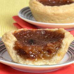 two small pies sitting on top of white plates