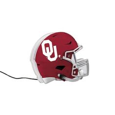 a red and white football helmet with the letter u on it's side is shown