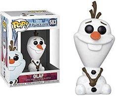 the pop vinyl figure is in front of a box with an image of a snowman