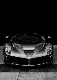 a black and white photo of a sports car