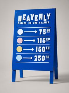 a blue sign that says heavenly prices on our frankss and points to the nearest places