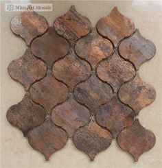 an old, rusty tile is displayed on the wall