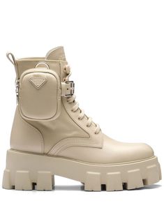 beige logo-print tongue side zip fastening ankle-length pull-tab at the heel round toe front lace-up fastening chunky rubber sole Prada Monolith Boots, Prada Monolith, Lug Boots, Boot Stand, Fabric Boots, Beige Outfit, Miuccia Prada, Hot Sneakers, Military Inspired