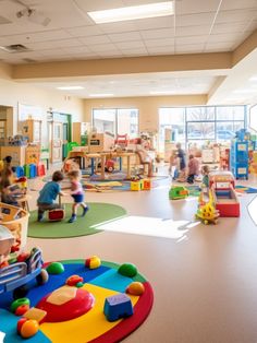 children's play area with toys and soft foam flooring in large school building