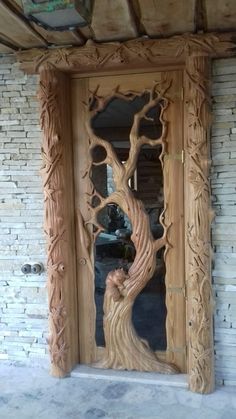 a wooden door with carved wood carvings on it