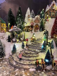 a christmas village with lots of trees and lights