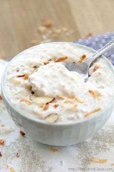 a bowl filled with oatmeal sitting on top of a white table cloth