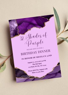 a purple and gold birthday party card with flowers on the front, in shades of purple