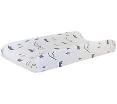 a white crib mattress with black cats and birds printed on the top, in front of a white background